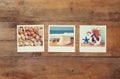 Top view of instant photos album on wooden background Royalty Free Stock Photo