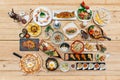 Top view of International Foods: Japanese, Thai, Mexican. Italian and Indian on wooden table.