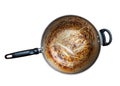 Top view of iron frying pan with burning mark, oily stains after cooking. Ingrain burning on iron pan, black handle, big area of Royalty Free Stock Photo