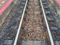 Top view iron and stone rustic railroad tracks selectable focus image for train travel concept background.