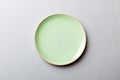 Top view of isolated of colored background empty round green plate for food. Empty dish with space for your design Royalty Free Stock Photo