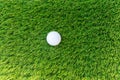 Top view an isolated golf ball on a synthetic grass Royalty Free Stock Photo