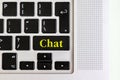 Top view isolated laptop keyboard with yellow `chat` text on button, concept design f Royalty Free Stock Photo
