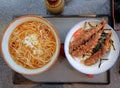 Top view, Japanese cusine, lunch set consists of hot soba noodles and Ten Don Shrimp Tempura on top of steamed rice Rice Bowl Royalty Free Stock Photo