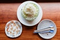 Top view of Japanese melon KakigÃÂri shaved ice dessert served in half of melon and sliced Pama Ham. With Dessert spoons in plate Royalty Free Stock Photo