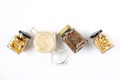 Top view of jars full of oats and various crunchy granola - plain, dried fruits, nuts and chocolate. Healthy eating concept Royalty Free Stock Photo