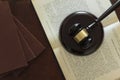 Top view of Judge`s gavel on top of open law book