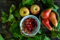 Top view of the juicy red grapes with pears in the bowl on the wooden surface Royalty Free Stock Photo