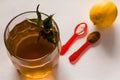 Top view of Kahwa,traditional Indian Kashmiri herbal tea with lime,ice cubes on white background.