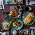 Top view of Kaiseki sushi platter combo set on the serving board in the fine dining Japanese restaurant