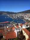 Top view of Kavala harbor with many rooftops and clear blue sky. Postcard photo, city landscape, urban Royalty Free Stock Photo