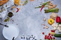 Top view of a kitchen table with chili pepper, asparagus, salad pepper, corkscrew, mushrooms, garlic on a gray Royalty Free Stock Photo