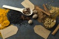 Top view of kitchen table and lot of different spices with paper tags on it Royalty Free Stock Photo