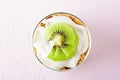 Top view kiwi dessert on pink background