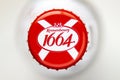 Top view of a Kronenbourg 1664 Blanc Fruit Rouges crown beer bottle caps