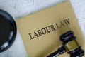 Top view of Labour Law book with gavel on marble background Royalty Free Stock Photo