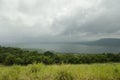 Top view of lake and mountains under rainy sky far away