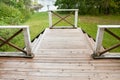 Top view of lake and old wooden porch with staircase, siding house exterior Royalty Free Stock Photo