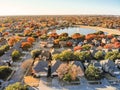 Top view lakeside houses and fall foliage near Dallas, Texas