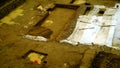 Top view of land with excavations and archaeological surveys with plastic sheets to protect the rain
