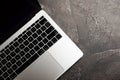 Top view of laptop with black keyboard on black texture background. Royalty Free Stock Photo