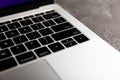 Top view of laptop with black keyboard on black texture background. Royalty Free Stock Photo