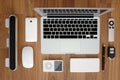 Top view of laptop computer close with smartphone, remote, mouse, speaker, portable music player, battery pack, remote Royalty Free Stock Photo