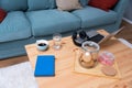 Top view laptop computer, coffee cup, book, wireless headset, cookies in jar and glass of water on the table or desk at home Royalty Free Stock Photo