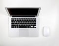 Top view of laptop computer with open display screen monitor and mouse isolated on white background Royalty Free Stock Photo
