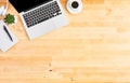 Top view of laptop computer on wooden office desk