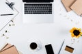 View of laptop, smartphone with blank screen, sunflower, clipboard, cup of coffee, craft paper, credit card, binder