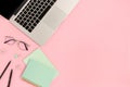 Top view of laptop and stationery on a pink pastel background Royalty Free Stock Photo