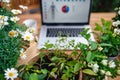 Top view of laptop on table on balcony in summer, outdoors office concept. Royalty Free Stock Photo