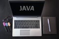 Top view of laptop with text Java. JAVA inscription on laptop screen and keyboard. Learn Java programming language, computer Royalty Free Stock Photo