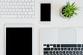 Top view of laptops with digital tablet and smartphone on table top Royalty Free Stock Photo