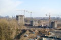 Top view of a large construction site with cranes and buildings houses concrete monolithic frame panel multi-storey Royalty Free Stock Photo