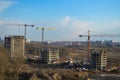 Top view of a large construction site with cranes and buildings houses concrete monolithic frame panel multi-storey Royalty Free Stock Photo