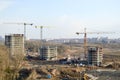 Top view of a large construction site with cranes and buildings houses concrete monolithic frame panel multi-storey Royalty Free Stock Photo