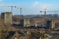 Top view of a large construction site with cranes and buildings houses concrete monolithic frame panel multi-storey Royalty Free Stock Photo