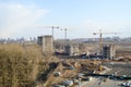 Top view of a large construction site with cranes and buildings houses concrete monolithic frame panel multi-storey Royalty Free Stock Photo