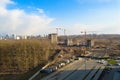 Top view of a large construction site with cranes and buildings houses concrete monolithic frame panel multi-storey skyscrapers of Royalty Free Stock Photo