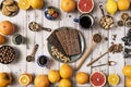 Top view of a large still life with a variety of citrus fruits, chocolate bonbons,