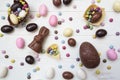 Top view of large variety of easter sweets, chocolate eggs, chocolate bunny, sweet almonds and other candies