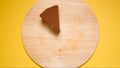 TOP VIEW: Last piece of Chocolate cake on yellow background Royalty Free Stock Photo