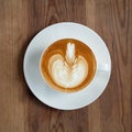 Top view latte art coffee on wood background