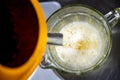 Top view of lemon juice filling jug from juicer Royalty Free Stock Photo