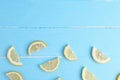 Top view lemon slice flat lay on blue wooden background