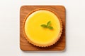 Top View, Lemon Tart On A Wooden Boardon White Background