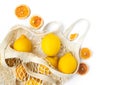 Top view Lemons in an eco-friendly bag on a on a white isolated background