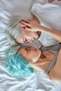 Top view Lesbian couple kissing and hugging on bed, give each other passionate kiss Royalty Free Stock Photo